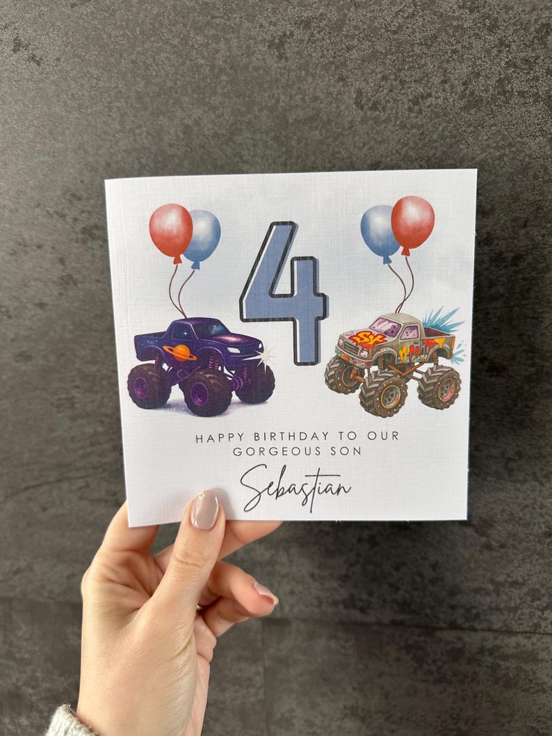 May include: Birthday card with monster truck illustrations, balloons, and the number 4. The text says "Happy Birthday to our gorgeous son Sebastian."