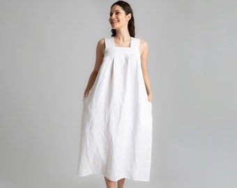 Robe en lin blanche avec grandes poches sans manches et dos en V pour femme