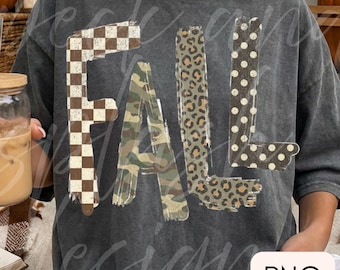 May include: A charcoal grey short-sleeve t-shirt featuring the word FALL in large block letters. Each letter has a distinct pattern: the F is brown and white chequered, the A is green camouflage, the L is leopard print, and the L is brown polka dot.