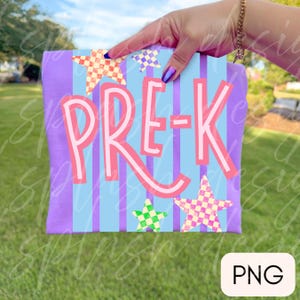 May include: A purple t-shirt featuring a light blue vertical striped pattern and the text PRE-K in large pink letters. The design includes three checkered stars in orange, green, and yellow, positioned around the central text graphic.