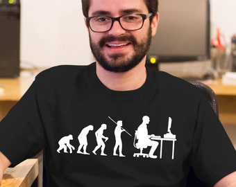 May include: A black t-shirt with a white graphic of the evolution of humans, ending with a person sitting at a computer. The graphic depicts the progression from a primitive ape to a modern human using a computer.