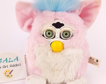 珍しいピンクとベージュのファービー偽物。美しい目の色で動作せず