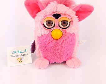 珍しいピンクとベージュのファービー偽物。美しい目の色で動作せず