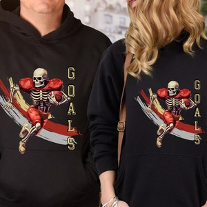 Sudadera con capucha de fútbol, esqueleto de Halloween, objetivos de casco de zona de anotación de Ghost Play, halcones, delfines, cardenales, mamá de deportes universitarios de escuela secundaria NFL