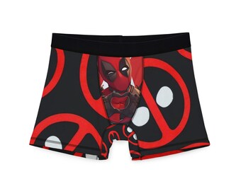 Peut inclure: Boxer noir avec un motif rouge et blanc de Deadpool. Le motif représente Deadpool faisant un cœur avec ses mains.