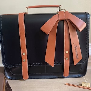 Vegan leather laptop bag for women. Black and tan leather laptop bag for women bow accent. Ladies work briefcase computer compartment. Work satchel for women. Custom graduation gift for woman. Custom new job gift for woman. Promotion gift for her.