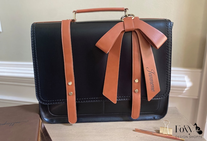 Vegan leather laptop bag for women. Black and tan leather laptop bag for women bow accent. Ladies work briefcase computer compartment. Work satchel for women. Custom graduation gift for woman. Custom new job gift for woman. Promotion gift for her.