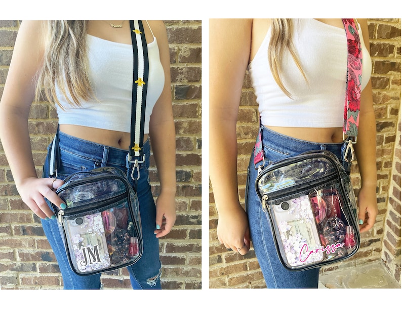 May include: Two clear plastic crossbody bags with black straps. The bag on the left has a black and white striped strap with gold bee accents and the text "JM" inside. The bag on the right has a pink and green floral strap and the text "Carissa" inside.