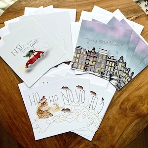 Conjunto de cartões de Natal com designs diversos - conjunto de 12 cartões com envelope branco - formato quadrado 15x15 cm, tema natalino, casas, carro, gato