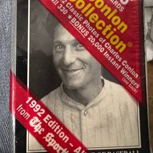 May include: A red and yellow card pack with the text "Conlon Collection 15 Cards" and "1905-1942 Classic Photos of Charles Conlon" and a black and white photo of a man in a baseball uniform. The text "1992 Edition - All New!" is on a red ribbon.