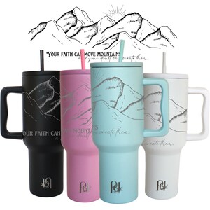 May include: Four stainless steel travel mugs with a mountain range design and the quote "Your faith can move mountains, not your doubt can create them." The mugs are in black, pink, blue, and white.