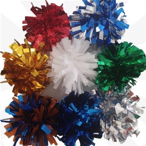 May include: A collection of nine spherical pom-poms made from thin, metallic, and matte plastic strips. The pom-poms feature a variety of colors including red, blue, silver, gold, white, green, dark blue, and a mix of orange and blue.
