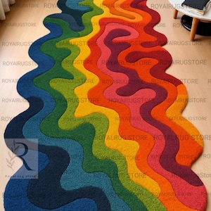 May include: A colorful, wavy rug in shades of blue, green, yellow, orange, and red. The rug has a unique, abstract design, adding a vibrant touch to any room. The rug's dimensions are not visible.
