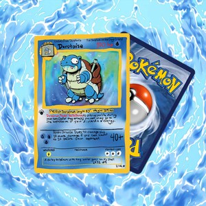 May include: A custom trading card titled Derptoise featuring a blue turtle creature with water guns on its shell. The card includes text such as Derpémon Power, Hydro Drizzle, and 100 HP. A second card showing the classic Pokémon logo is visible behind it.