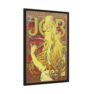 May include: A vintage poster featuring a woman with long flowing blonde hair. The poster is in a black frame and has a red background with a green and yellow geometric pattern. The word "JOB" is written in large letters at the top of the poster.