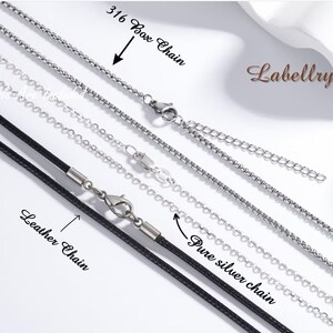 May include: An assortment of necklaces, including a 316 box chain, a leather chain, and a pure silver chain. The chains are silver and black, with clasps and extension chains. The word "Labellry" is in the upper right corner.