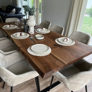 Solid walnut dining table with natural tree edge