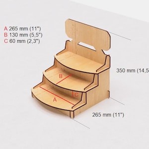 May include: A wooden display stand with three shelves. The shelves are curved and the stand is 14.5 inches tall and 11 inches wide. The stand is made of natural wood and has a light brown color.
