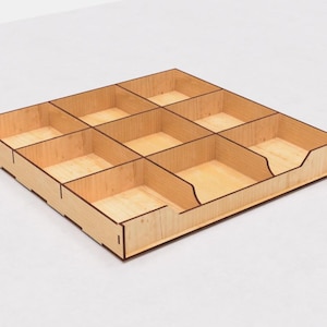 May include: A wooden organizer with nine compartments, perfect for storing small items. The organizer is made of light wood with a natural finish.