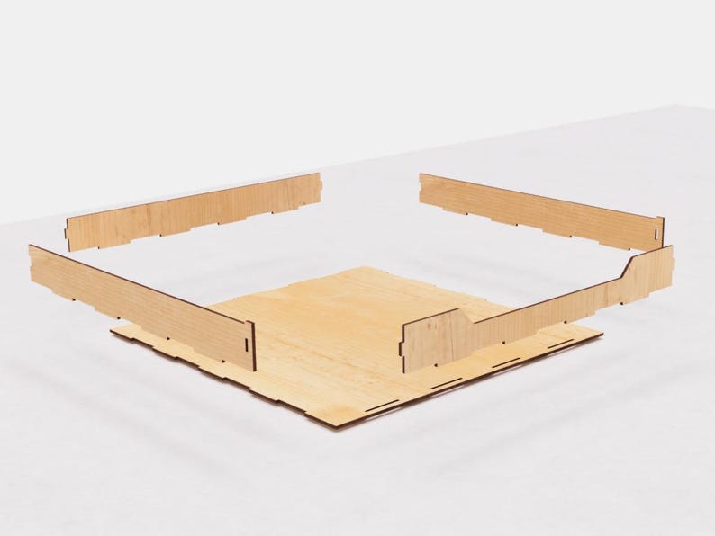 May include: A wooden box with four sides and a base. The sides are assembled to form a square shape. The box is made of light brown wood with a natural finish.