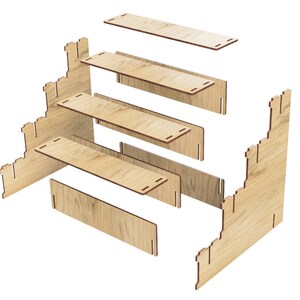 May include: A wooden castle-shaped shelf unit with five shelves. The shelves are disassembled and laid out flat, showing the individual pieces.