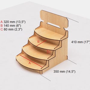 May include: Wooden display stand with four shelves, each with a rounded front edge. The stand is 17 inches tall, 14.5 inches wide, and the shelves are 13.5 inches, 6 inches, and 2.3 inches deep.