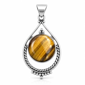 May include: A silver pendant featuring a round, polished tiger's eye gemstone set within a teardrop-shaped frame. The frame includes a twisted rope texture along the sides and small decorative silver beads at the top and bottom points.