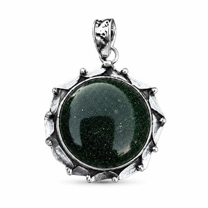 May include: A round pendant featuring a dark green, glittery stone set in a textured, oxidized silver frame with a scalloped edge. The pendant includes a decorative silver bail at the top, showcasing a metallic finish with dark, recessed details.