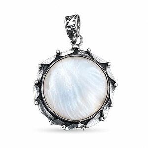 May include: A round pendant featuring a central iridescent white mother-of-pearl inlay set within a dark, oxidized silver frame. The frame has a scalloped, petal-like edge with small raised dots and a textured, weathered finish on the bail.