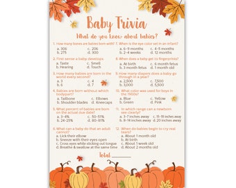 May include: A Baby Trivia game card featuring autumn-themed illustrations of orange pumpkins and fall leaves in red, orange, and yellow. The text includes twelve multiple-choice questions about babies, with a space at the bottom for a total score.