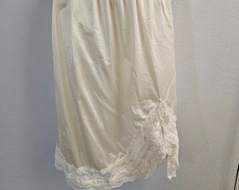 Vintage Beige Danberry Apparel Half Slip Size 2 X.  Features Slit on Front Left Trimmed in Lace and Ribbons Along Hem