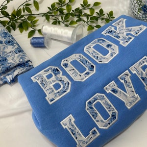 Blue floral fabric embroidered book lover sweatshirt, readers gift, book sweatshirt