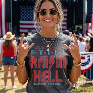 250 Years Still Raisin Hell Retro Rocker 4th of July T-shirt | 1776-2026 Patriotic Stars