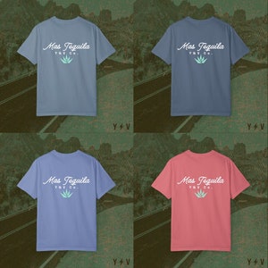 May include: Four t-shirts in blue, light blue, and pink colours. Each shirt features a white graphic with the text "Mas Tequila Y&V Co."