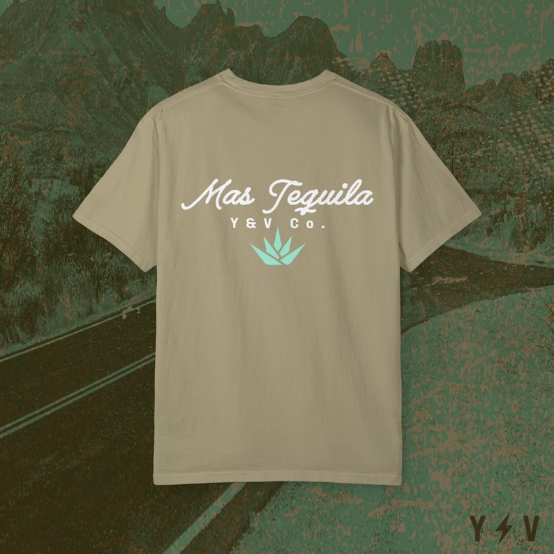 May include: A tan t-shirt with a white graphic on the back that says "Mas Tequila Y&V Co." with a teal agave plant graphic.