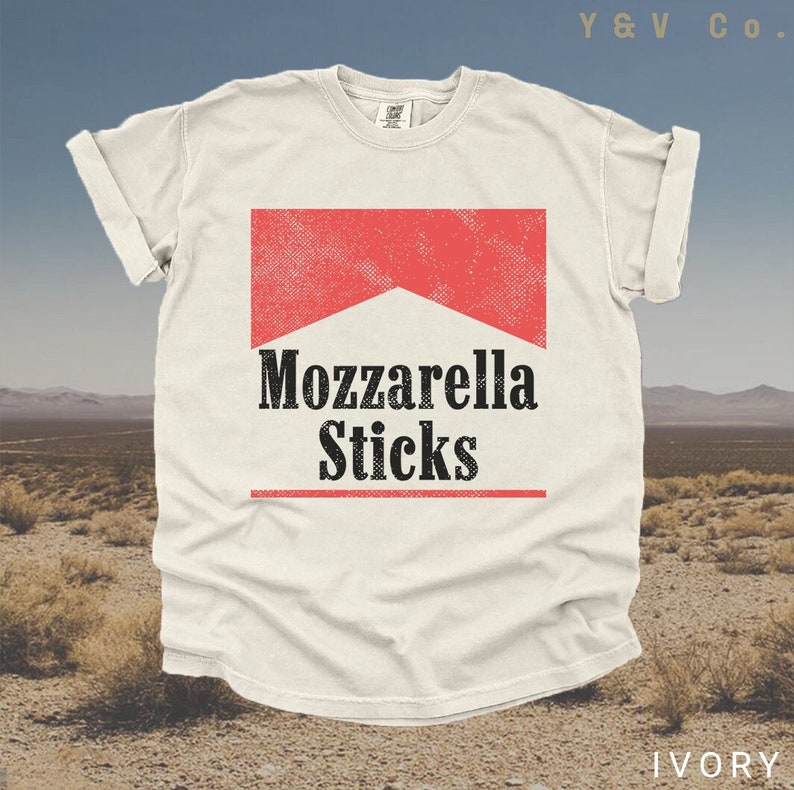 May include: A white t-shirt featuring a red and white graphic that reads "Mozzarella Sticks". The graphic is styled to resemble a cigarette packet.