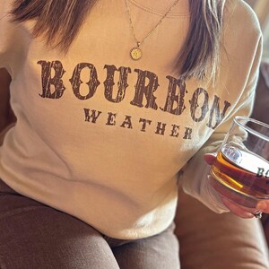 Bourbon Whiskey Weather Sweatshirt, Fall Sweater, Unisex Crewneck Pullover, Women's Winter Sweater, Whiskey Lover, Drinker - Cozy Sweatshirt Sand