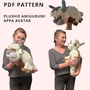 May include: A crocheted plush toy of Appa, the sky bison from Avatar: The Last Airbender. The toy is white with brown and gray accents. The toy is being held by a person.