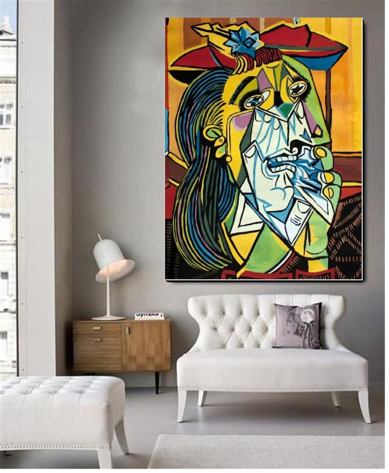 May include: A colorful painting of a woman with a red hat and a blue and green dress. She is crying and holding a white handkerchief to her face. The painting is done in a cubist style.