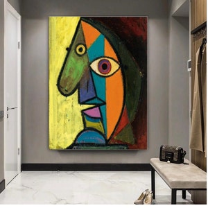May include: Abstract cubist style painting of a face with a yellow, green, blue, orange, red, purple, and brown color scheme.
