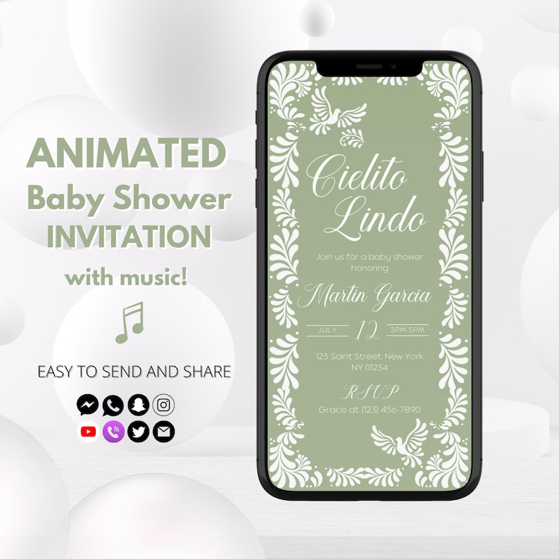 May include: A smartphone displays a baby shower invitation. The invitation features the text "Cielito Lindo" and details for Martin Garcia's baby shower. The phone also shows the words "Animated Baby Shower Invitation with music!" and social media icons.