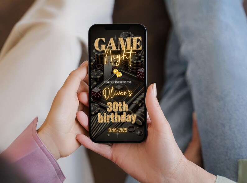 May include: A smartphone displaying a digital invitation for a game night party. The invitation features a black and gold design with playing cards, dice, and chips. The text reads "Game Night" and "You're invited to Oliver's 30th birthday 01/03/2025".