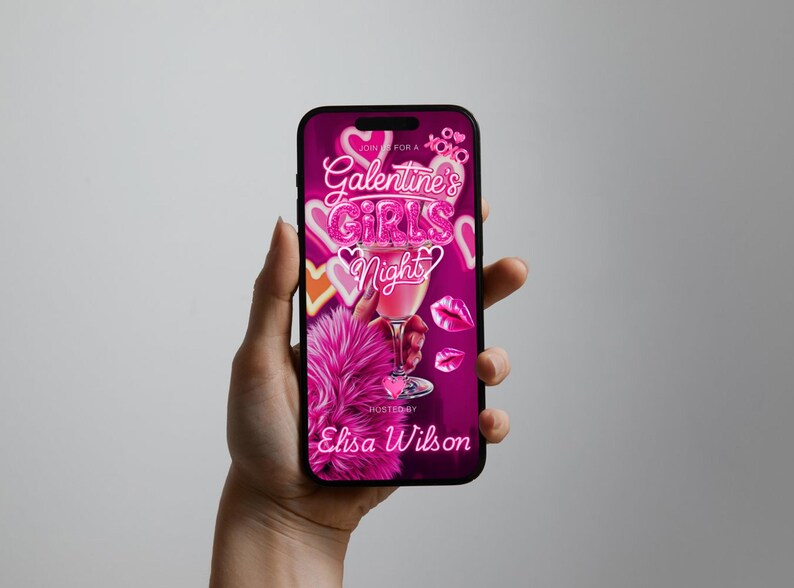 K&ouml;nnte beinhalten: Ein Smartphone zeigt eine lebendige rosa Grafik f&uuml;r eine Galentine's Girls Night-Veranstaltung. Das Design umfasst einen Cocktail, Herzen und den Text "Galentine's Girls Night". Veranstaltet von Elisa Wilson.