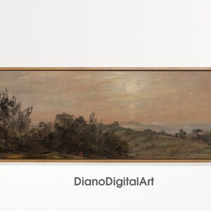 May include: A framed landscape painting depicting a rural scene with a distant view of a body of water. The sky is a soft pink and orange, with a bright white moon in the center. The foreground features a group of trees and a small path leading to a hill.