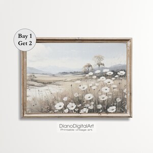 May include: A vintage-style painting of a field of white wildflowers with a distant view of a forest and hills. The painting is framed in a light brown wood frame.