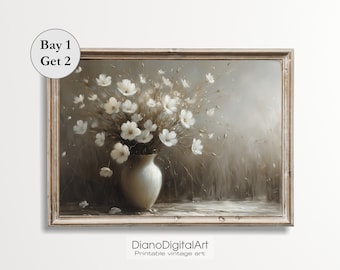 May include: A framed vintage-style print featuring a vase of white flowers. The artwork has a neutral color palette with a soft, blurred background. The text "Bay 1 Get 2" is in the upper left corner. The text "DianoDigitalArt Printable vintage art" is in the lower right corner.