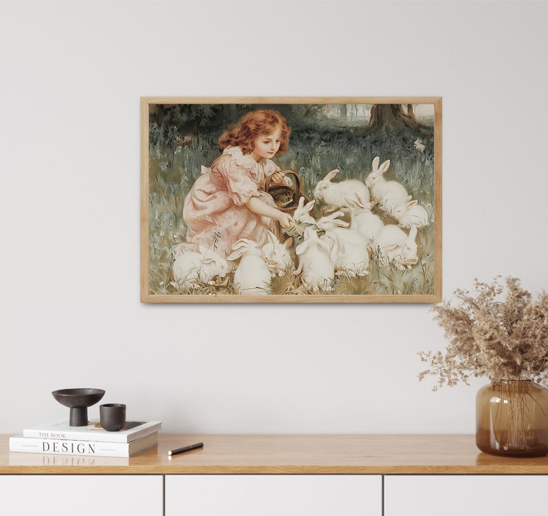 May include: A young girl in a pink dress feeds a group of white rabbits in a garden setting. The girl is holding a basket and the rabbits are gathered around her.
