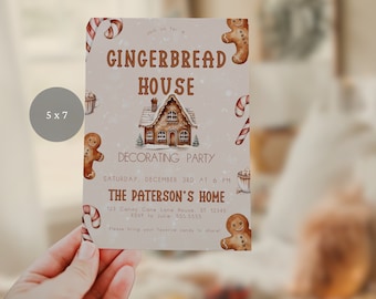 May include: A 5x7 inch invitation for a gingerbread house decorating party. The invitation features a gingerbread house, candy canes, and gingerbread men. The text on the invitation reads "Join us for a Gingerbread House Decorating Party, Saturday, December 3rd at 6 PM, The Paterson's Home, 123 Candy Cane Lane House, ST 12345, RSVP to Julie: 555.5555, Please bring your favorite candy to share!"