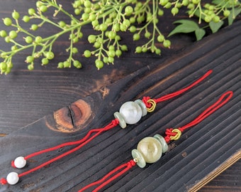 A pair of jade A bead mobile phone chains, yellow and green