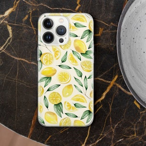 May include: A white iPhone case with a watercolor design of lemons and green leaves. The case has a clear back and a white front with a camera cutout.